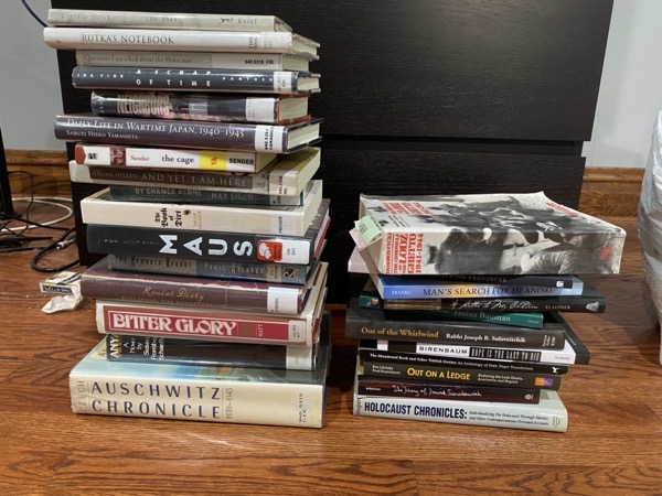 Two stacks of books representing my research reading for the novel