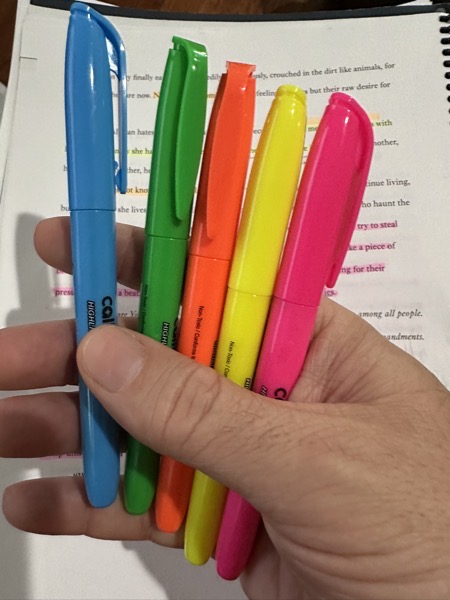 My highlighters and an obscured view of the manuscript getting marked up