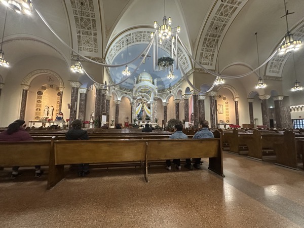 A view of the altar of the church taken when I arrived  for the morning Mass which didn’t take place. The church is somewhat unusual in its layout in that the semitransepts are roughly the same size as the nave, meaning most of the congregation is fairly close to the sanctuary.