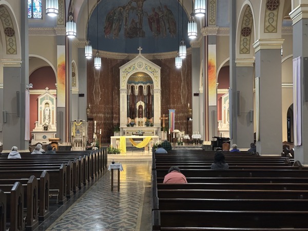 A view of the sanctuary and altar of Ascension church from the back of the church. The old altar is in the back of the sanctuary which has been extended to the intersection of the nave and the transept.