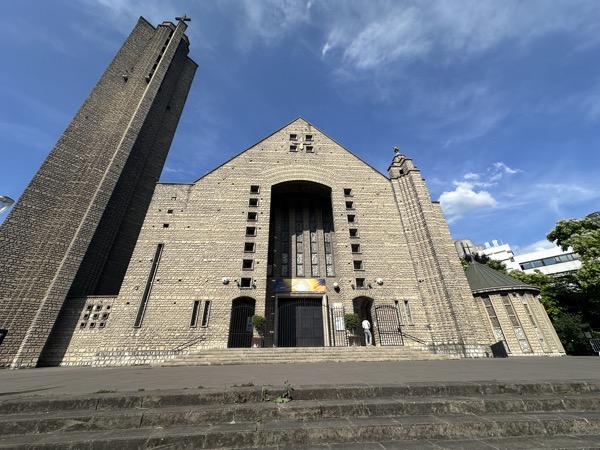 The view of the front of Sanctuaire de Notre Dame de Fatima, the bell tower is a free-standing structure to the left of the church