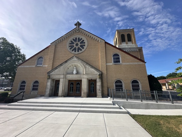 The front of Saint Veronica church in Flossmoor. A statue of the Infant Jesus of Prague is in the arch over the doorway