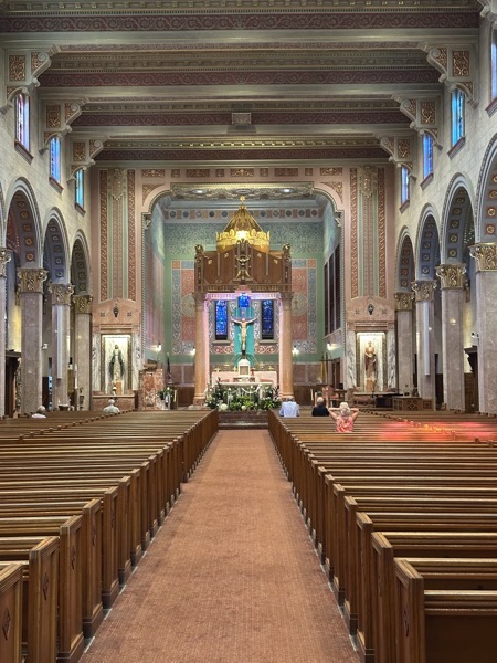 The interior of the church is in an art deco style with a lot of pink marble.