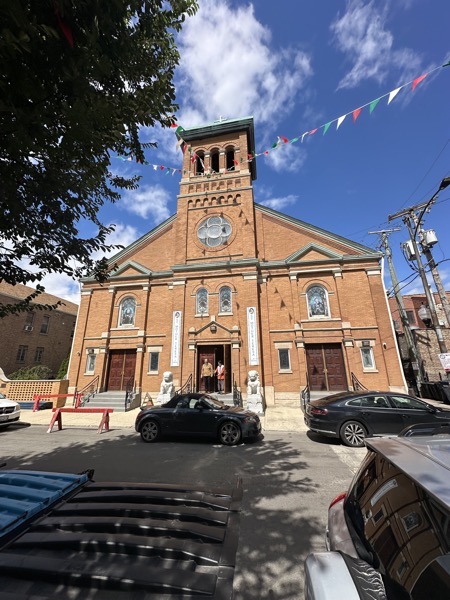 The exterior of Satin Therese Chinese Catholic Church, with two Chinese-style lions near the front entrance, the only conspicuously Chinese aspect of the church exterior.