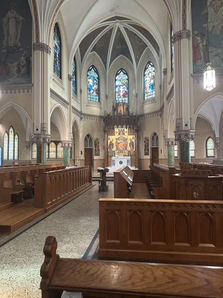 The view of the sanctuary of the church. The pews facing the center aisle are the choir stalls for the monks, apparently built with an optimistic view of the future growth of the community. Note that there is no altar facing the people in the sanctuary, only the main altar against the back wall.