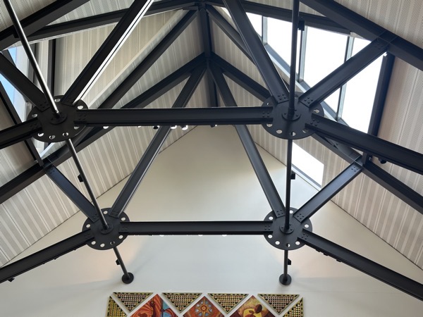 A close-up of the decorative archwork with steel I-beams and metal plates