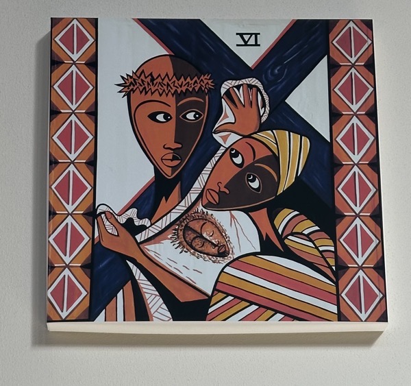 One of the stations of the cross, showing Veronica wiping Jesus’ face, again using a folk African–style in the artwork