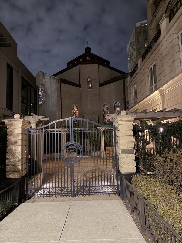 The exterior of the shrine as seen from behind the high rise. The shrine is surrounded by a garden which is behind a gate. I’m uncertain whether the gate is unlocked in general or at the moment when I was present
