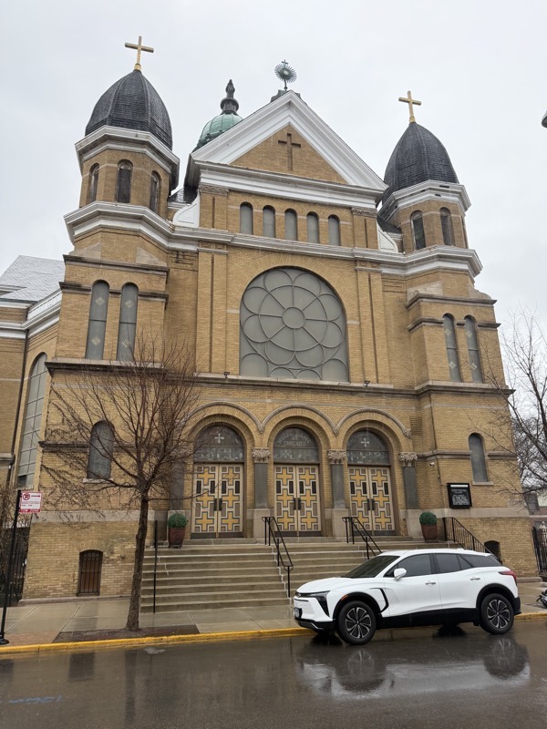 IMG_1183.jpeg The exterior of the church in a neo-renaissance style with two bell towers flanking the façade