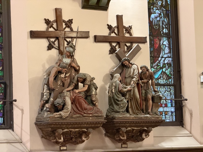 IMG_1199.jpeg Two of tHe sculpted stations of the cross depicting St Veronica’s encounter with Jesus and Jesus falling while carrying the cross. The stations are painted, but the paint has been flecking off