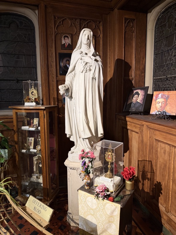 The saints chapel at the side of the church. There are a number of reliquaries in glass cases including relics from St Therese of Lisieux and a piece of cloth claimed to be from the tunic of St Joseph