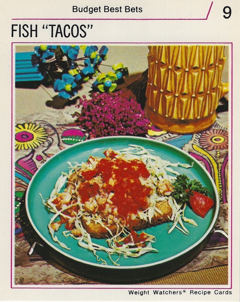 1970s Weight Watchers Recipe Card showing “FIsh ‘Tacos’”—finally scare quotes that earn their keep. It’s a slice of toast with bit of fish, some sort of weird red sauce and shredded lettuce scattered on top of it. There might also be corn. This is not a taco.